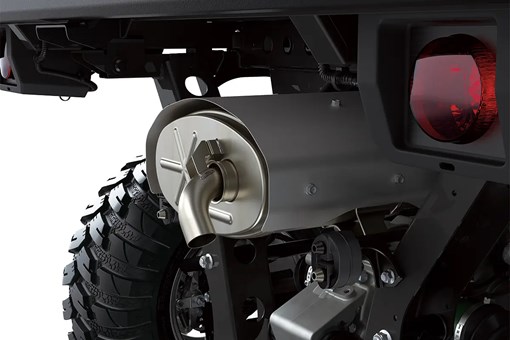 Detail photo of rear exhaust of a side x side staged in a white studio background. opens in a new window