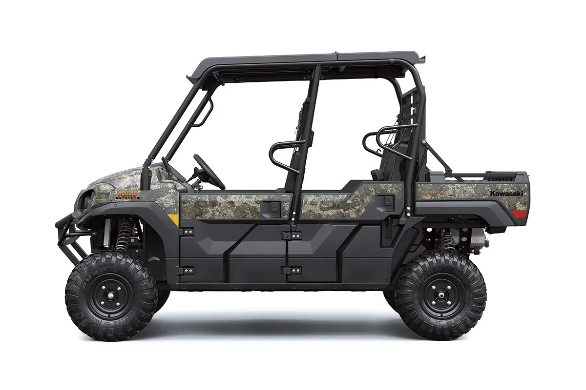 Left side view of a camo side x side staged in a white studio background.