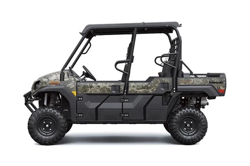 Left side view of a camo side x side staged in a white studio background. opens in a new window