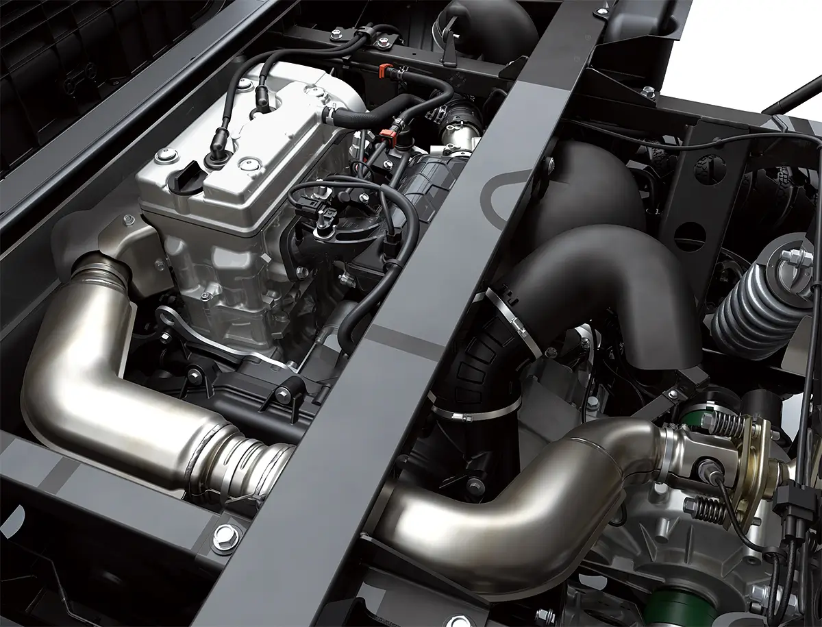Engine compartment of a side x side staged in a white studio background.