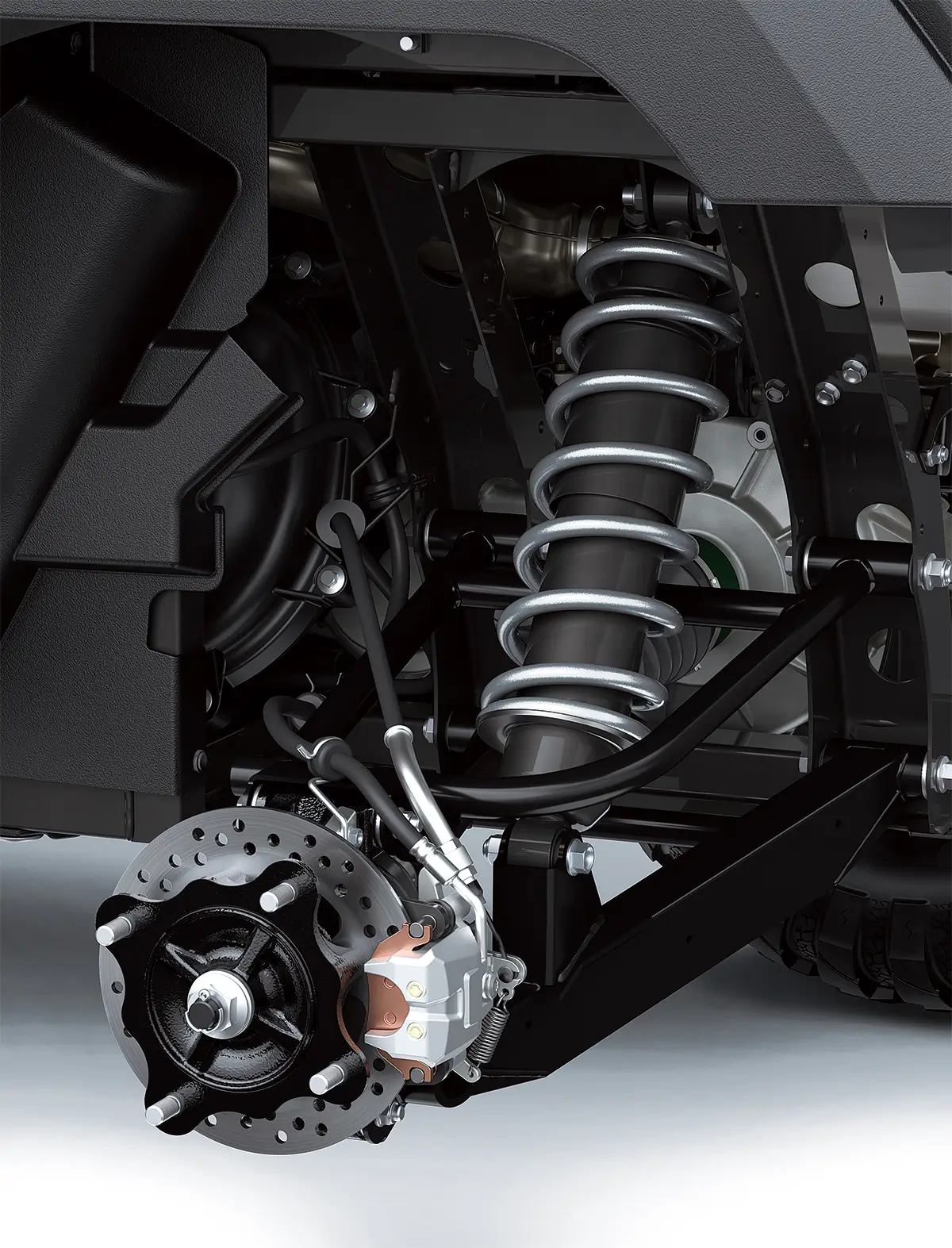 Detail view of the suspension of a side x side in a white studio background.