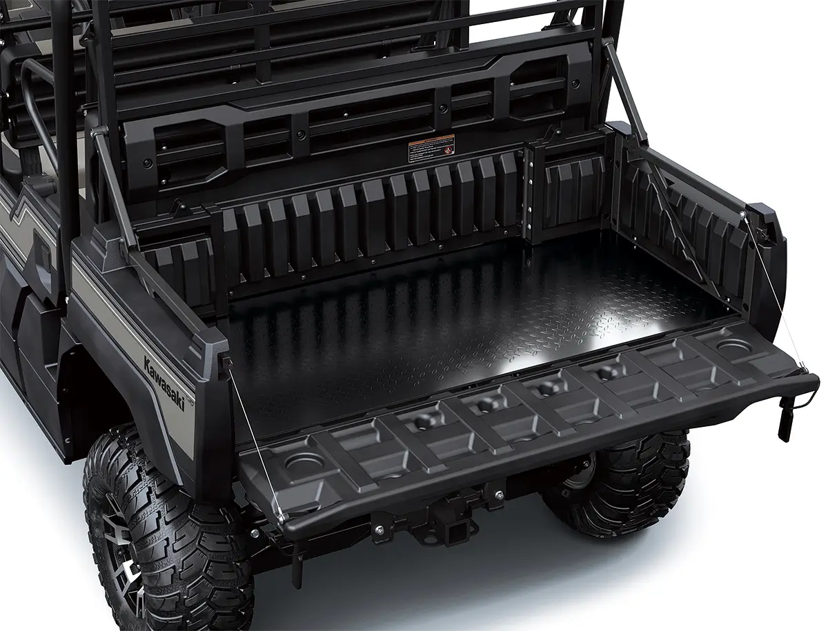 Cargo bed and tailgate of a side x side staged in a white studio background.