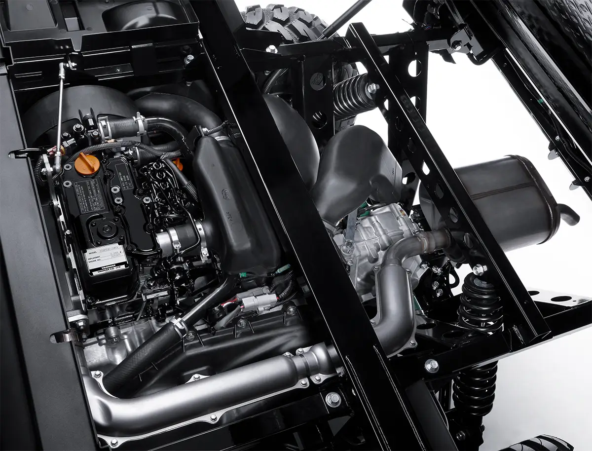 Engine compartment of a side x side staged in a white studio background.