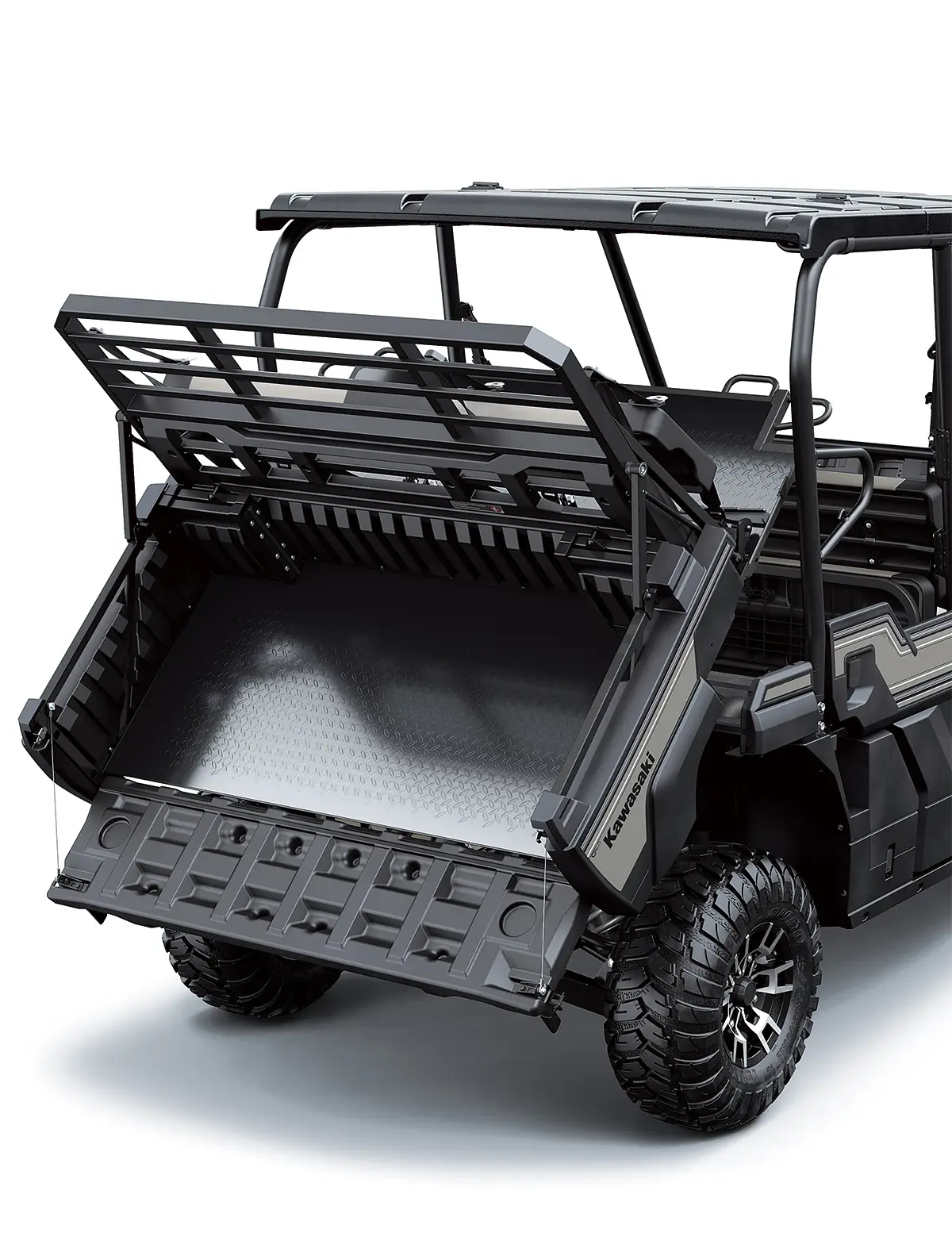 Cargo bed of a side x side in the tilt position staged in a white studio background.