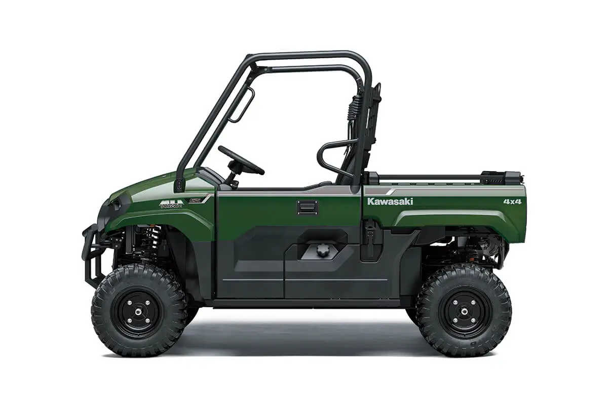 Left side view of a green side x side staged in a white studio background.
