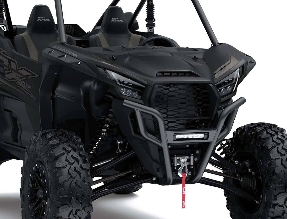 Close-up of the front end of a side x side staged in a white studio background.