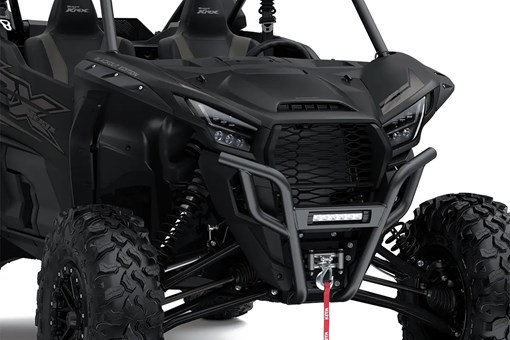 Close-up of the front end of a side x side staged in a white studio background. opens in a new window