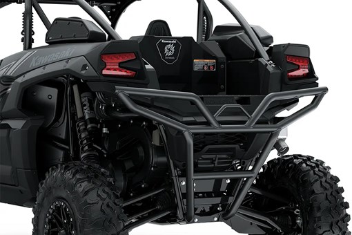 Close-up of the headlights and back end of a side x side staged in a white studio background. opens in a new window