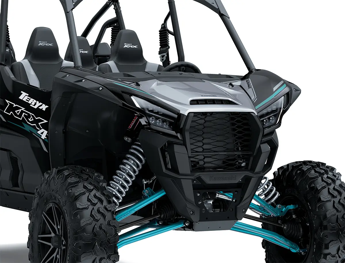 Close-up view of the front end of a side x side staged in a white studio background.