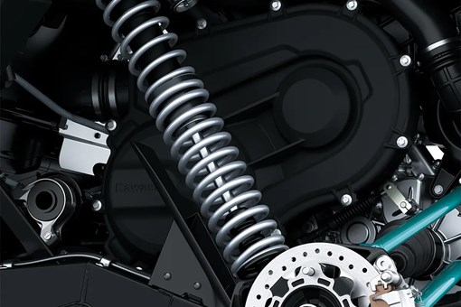 Close-up view of the front suspension and disc brake system of a side x side staged in a white studio background. opens in a new window