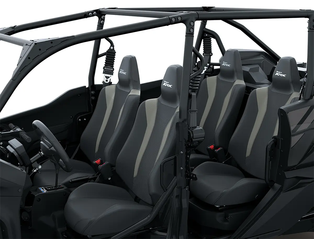 Three-quarter front angle of the four seats of a black side x side staged in a white studio background.