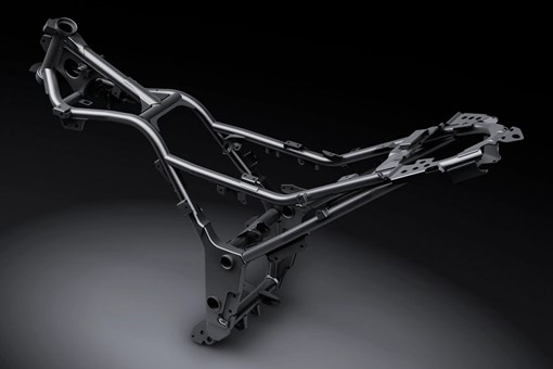 Side angle of the chassis of a motorcycle staged in a black studio background. opens in a new window