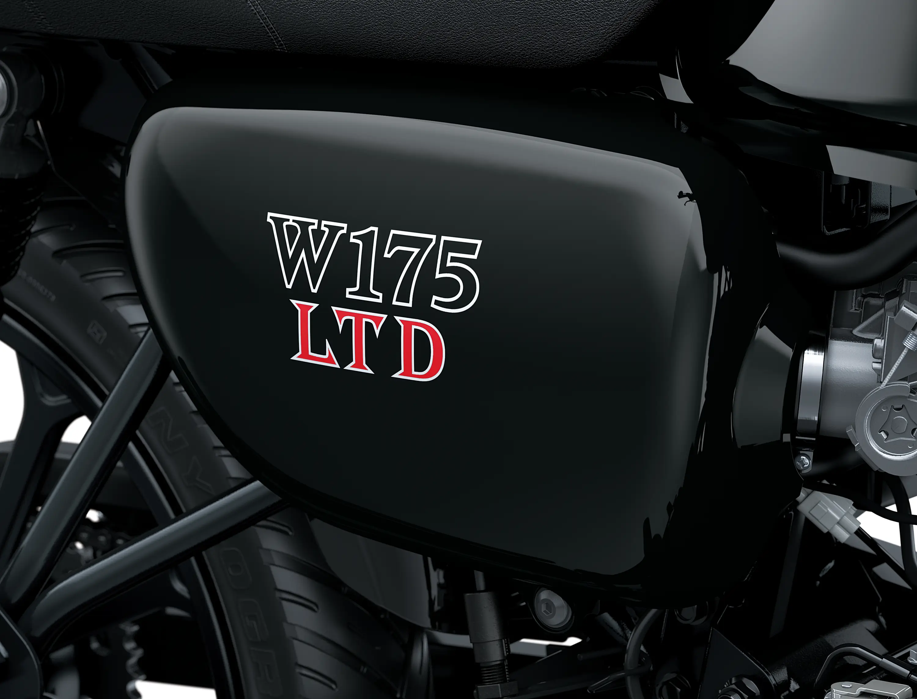 Close-up of the fuel tank of a motorcycle staged in a white studio background.