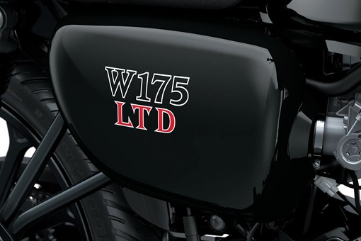 Close-up of the fuel tank of a motorcycle staged in a white studio background. opens in a new window