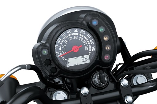 Close-up of the speedometer of a motorcycle staged in a white studio background. opens in a new window