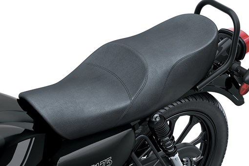 Close-up of the seat of a motorcycle staged in a white studio background. opens in a new window