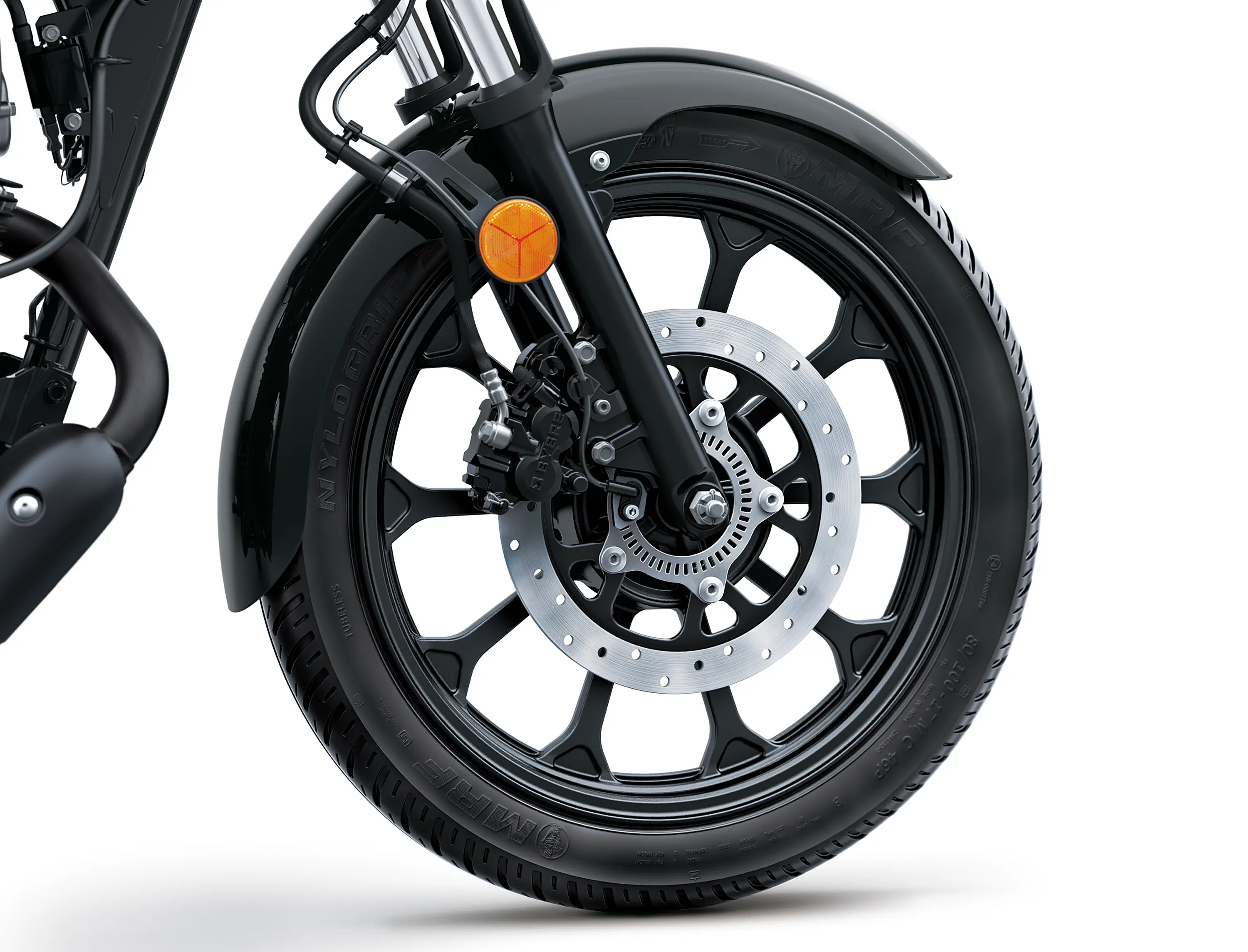 Close-up of the front wheel of a motorcycle staged in a white studio background.