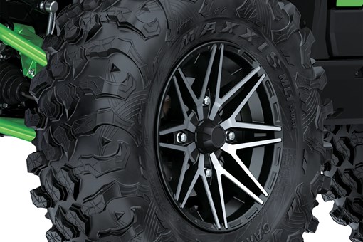 Close-up of a tire of a side x side staged in a white studio background. opens in a new window