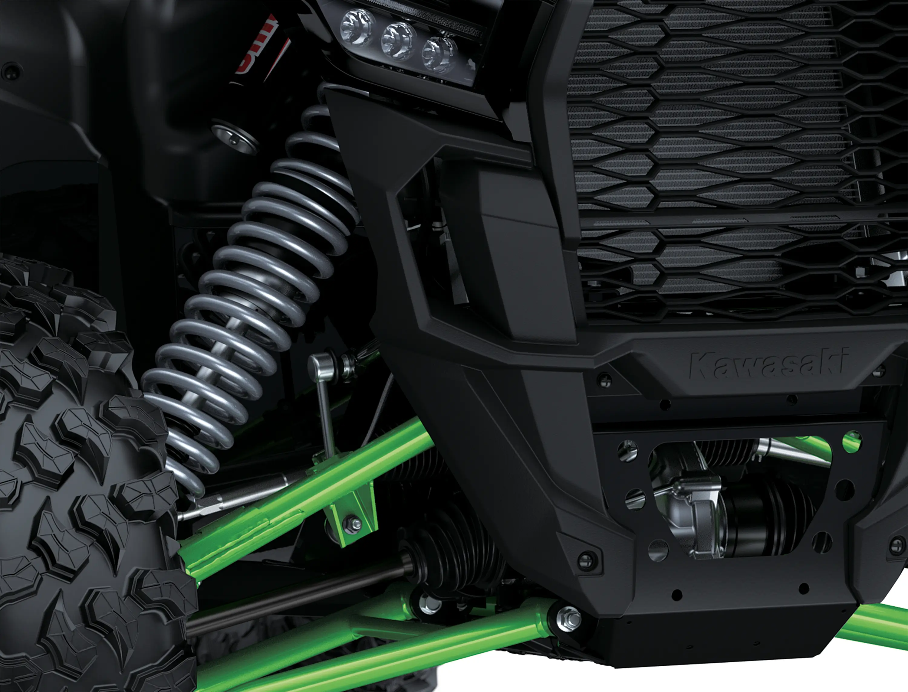 Close-up of the right-side a-arm and shock of a side x side staged in a white studio background.