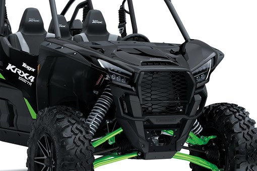 Close-up of the front end of a side x side staged in a white studio background. opens in a new window