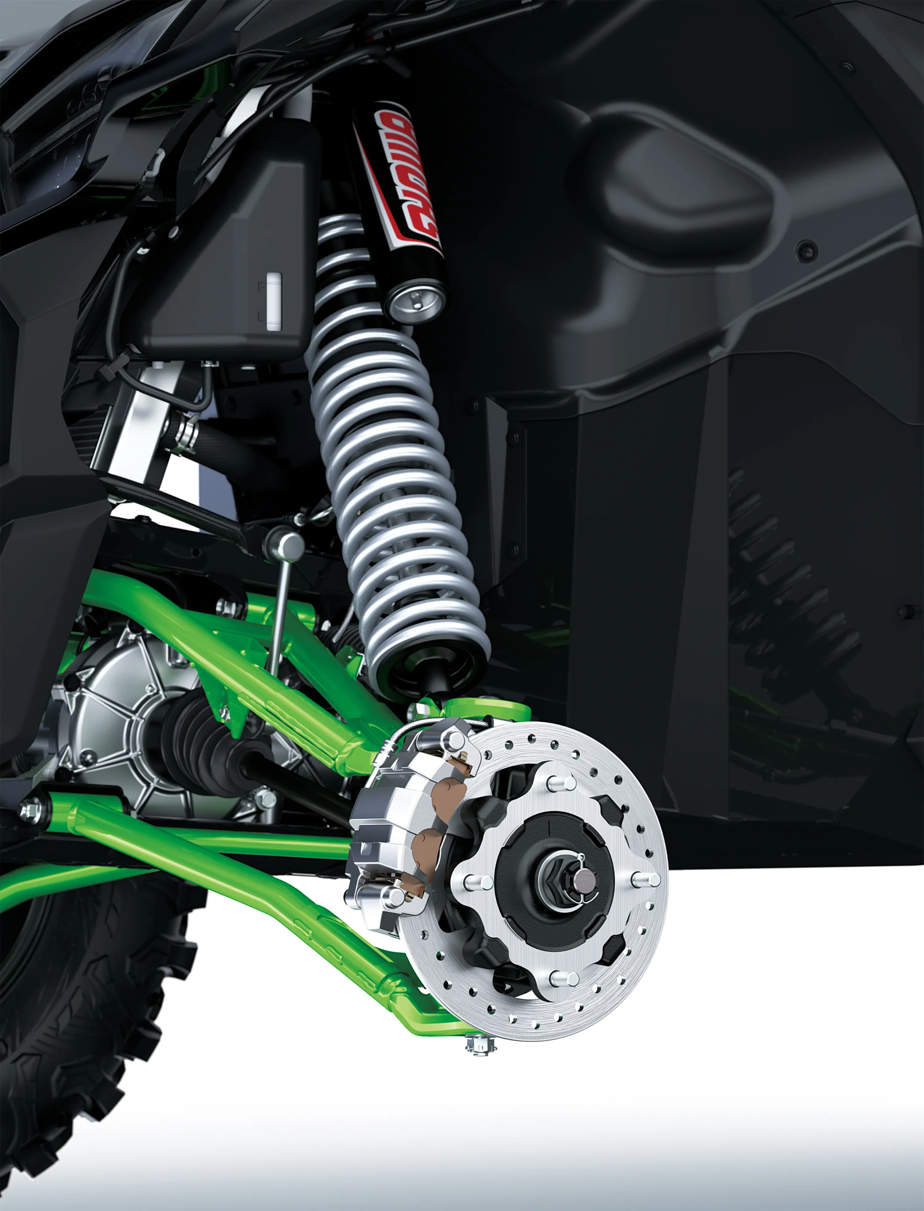 Close-up of the suspension system of a side x side staged in a white studio background.