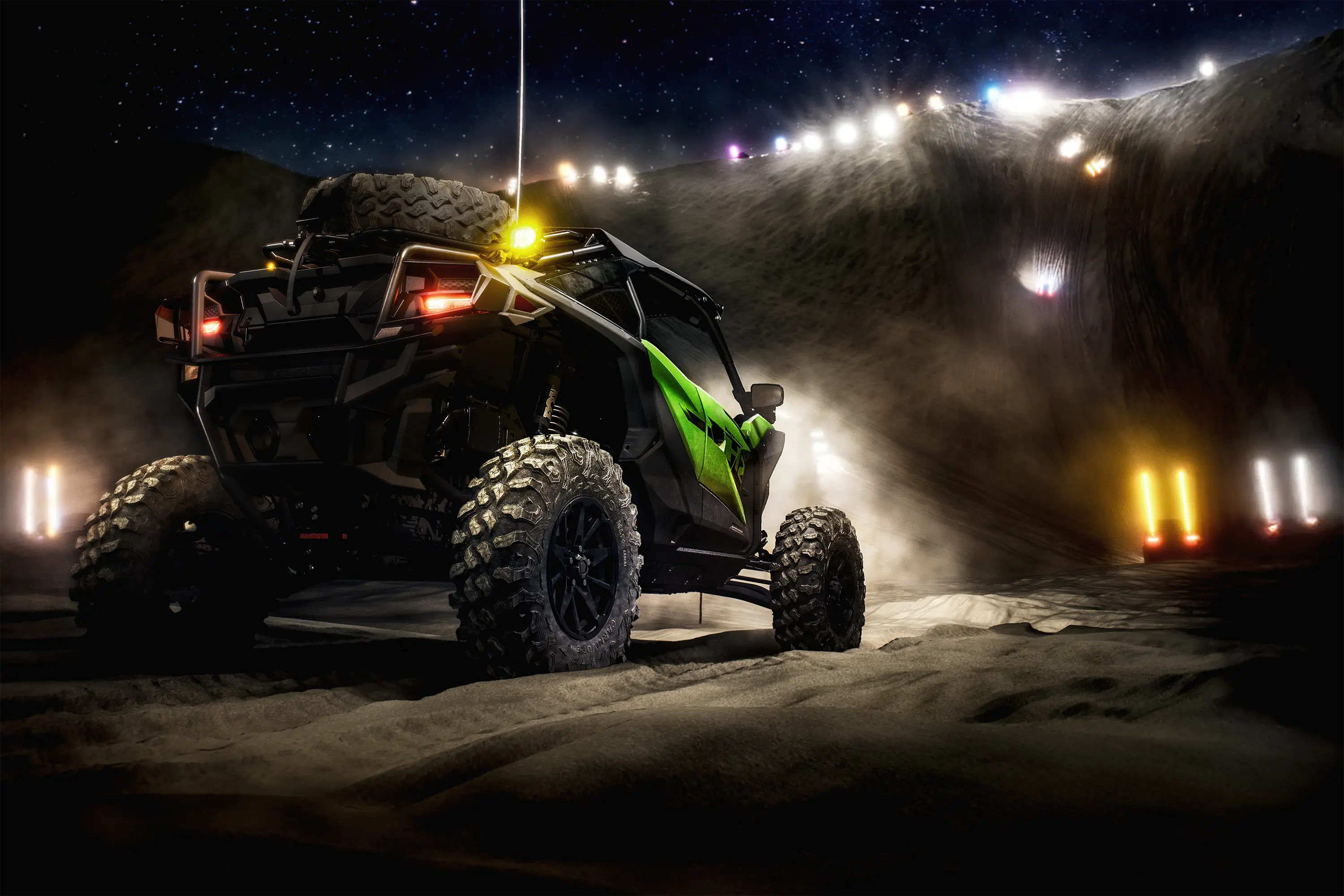 Three-quarter rear angle of a side x side parked off-road.
