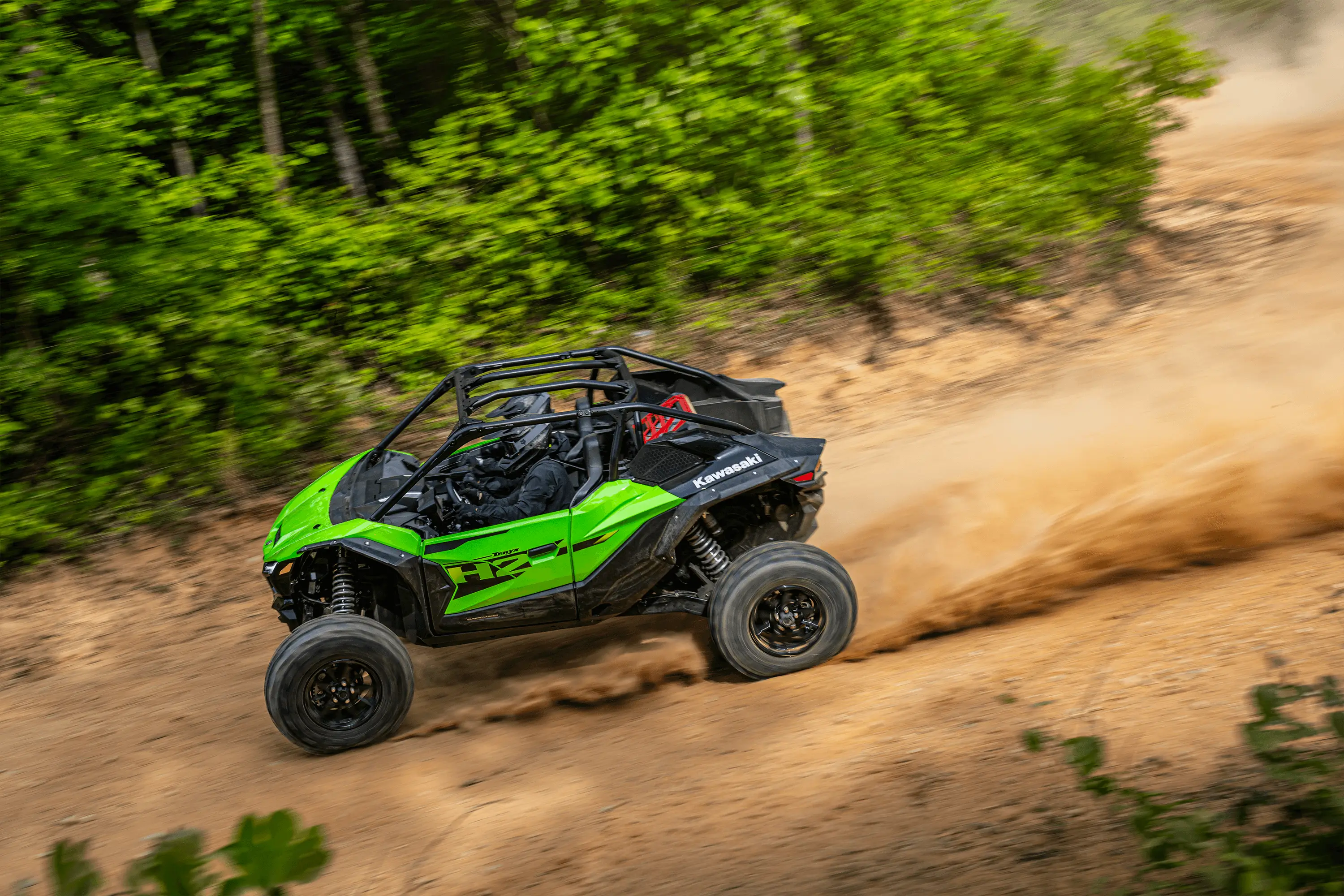 Overhead side angle of a person driving a side x side off-road.