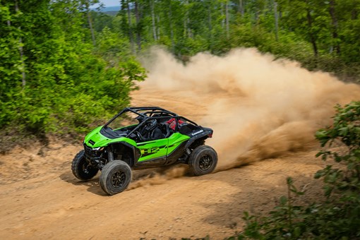 Overhead angle of a person driving a side x side off-road. opens in a new window