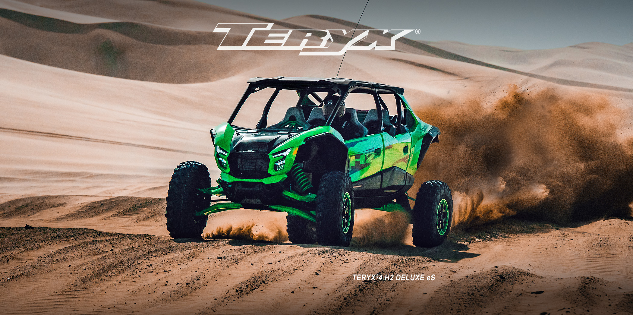 Teryx racing on a sand dune