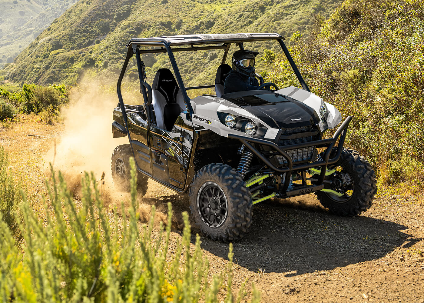 Teryx driving through a dirt path